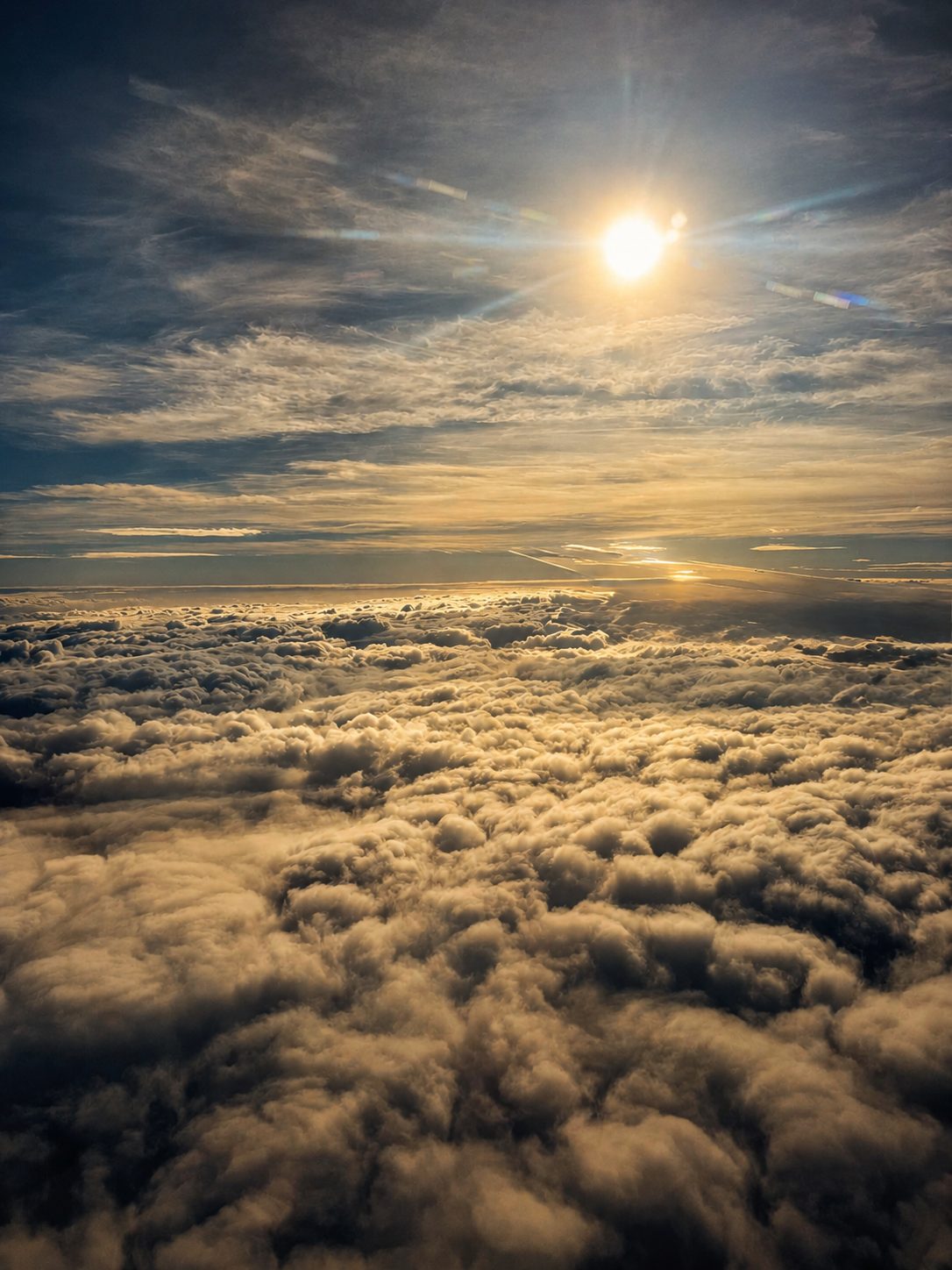 Sunlit cloud tops from the window seat