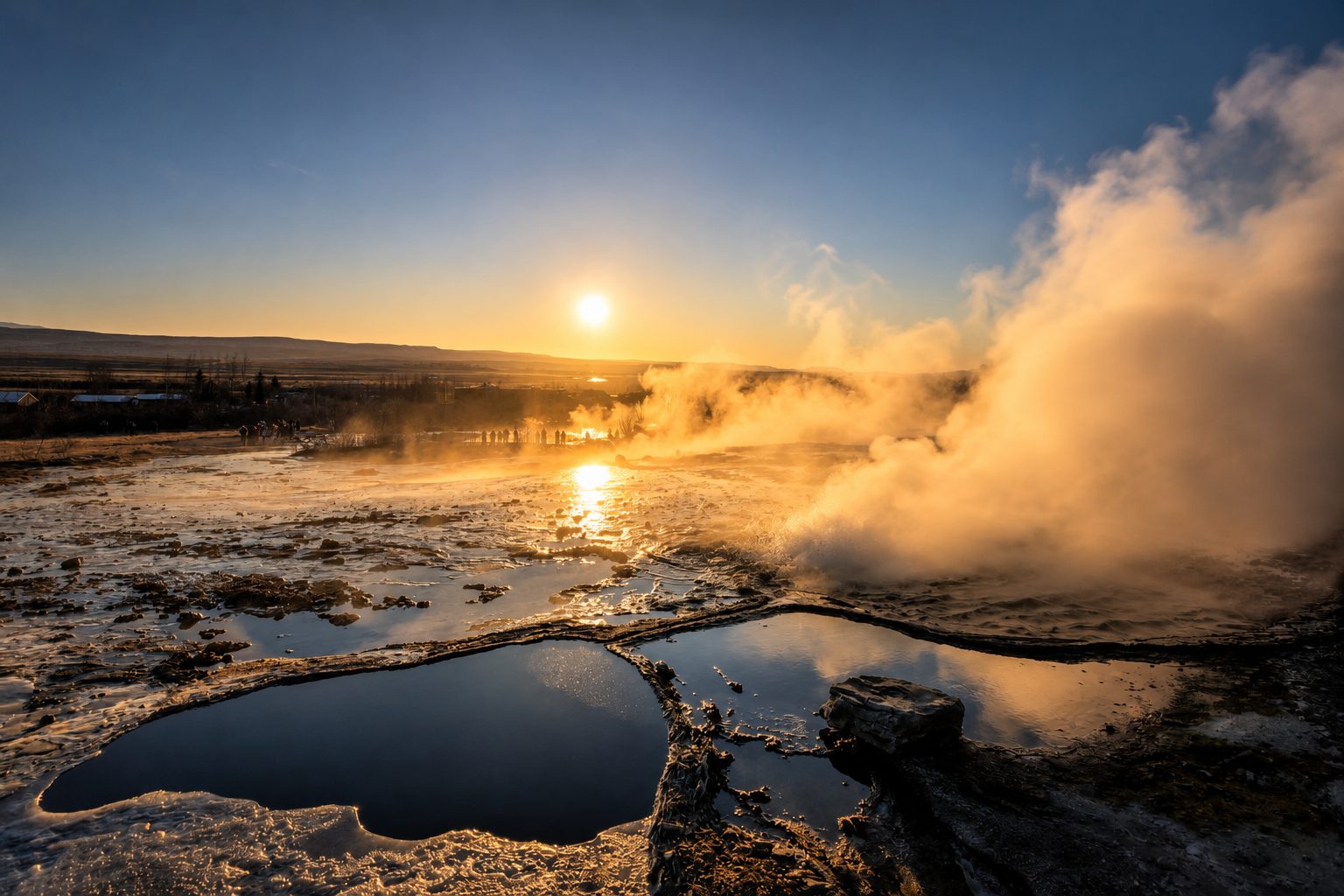 Steam drifting from the geyser field at sunset